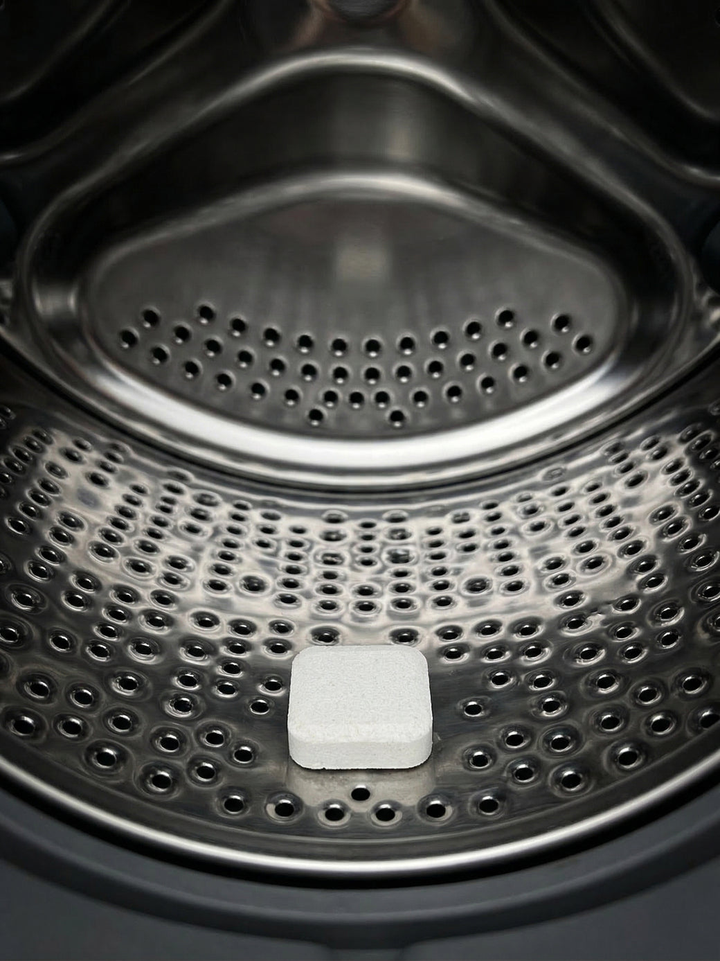 Cleaning tablet placed inside washing machine drum